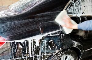 Washing a car with sponge